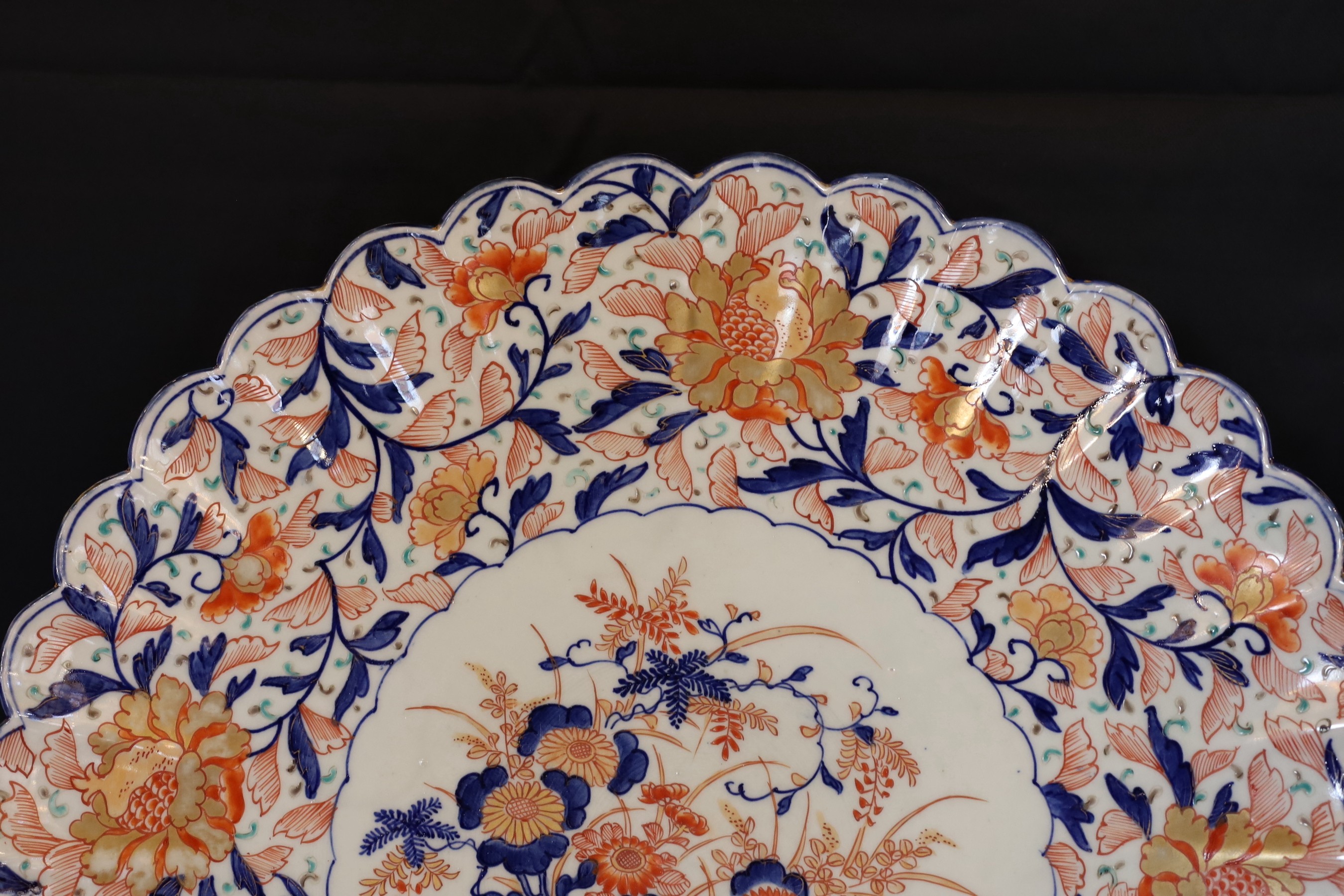 An Imari charger decorated with a central panel of flowers in a vase within floral borders, diameter 47 cm
